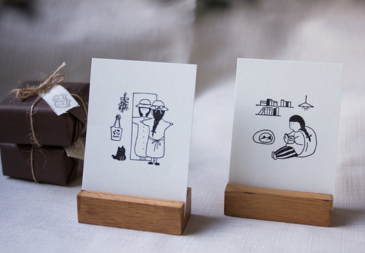 Ivy Snow Looking in the Mirror and Reading Wood Stamp